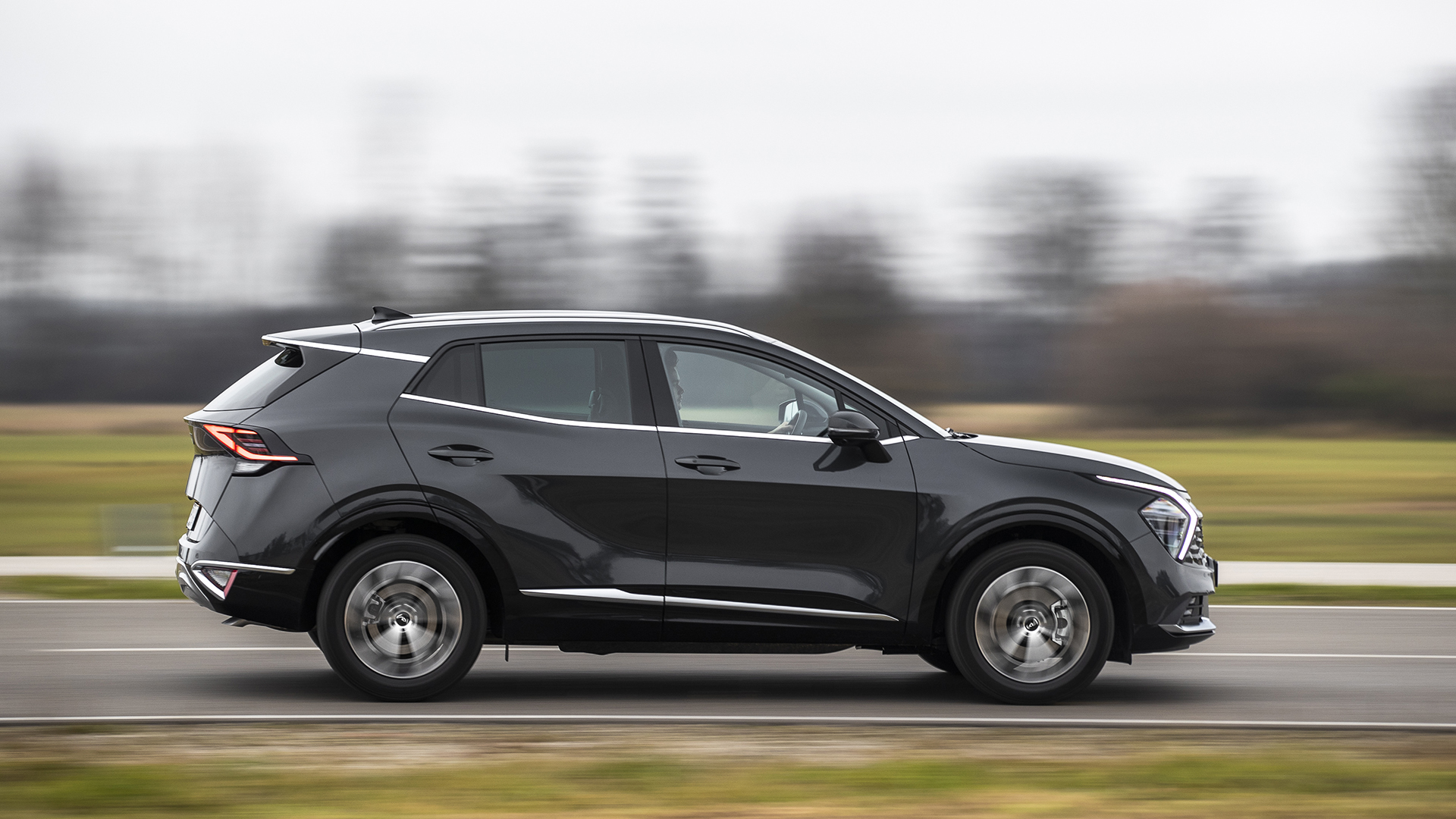 Kia Sportage 2023 in Flado in motion on the road