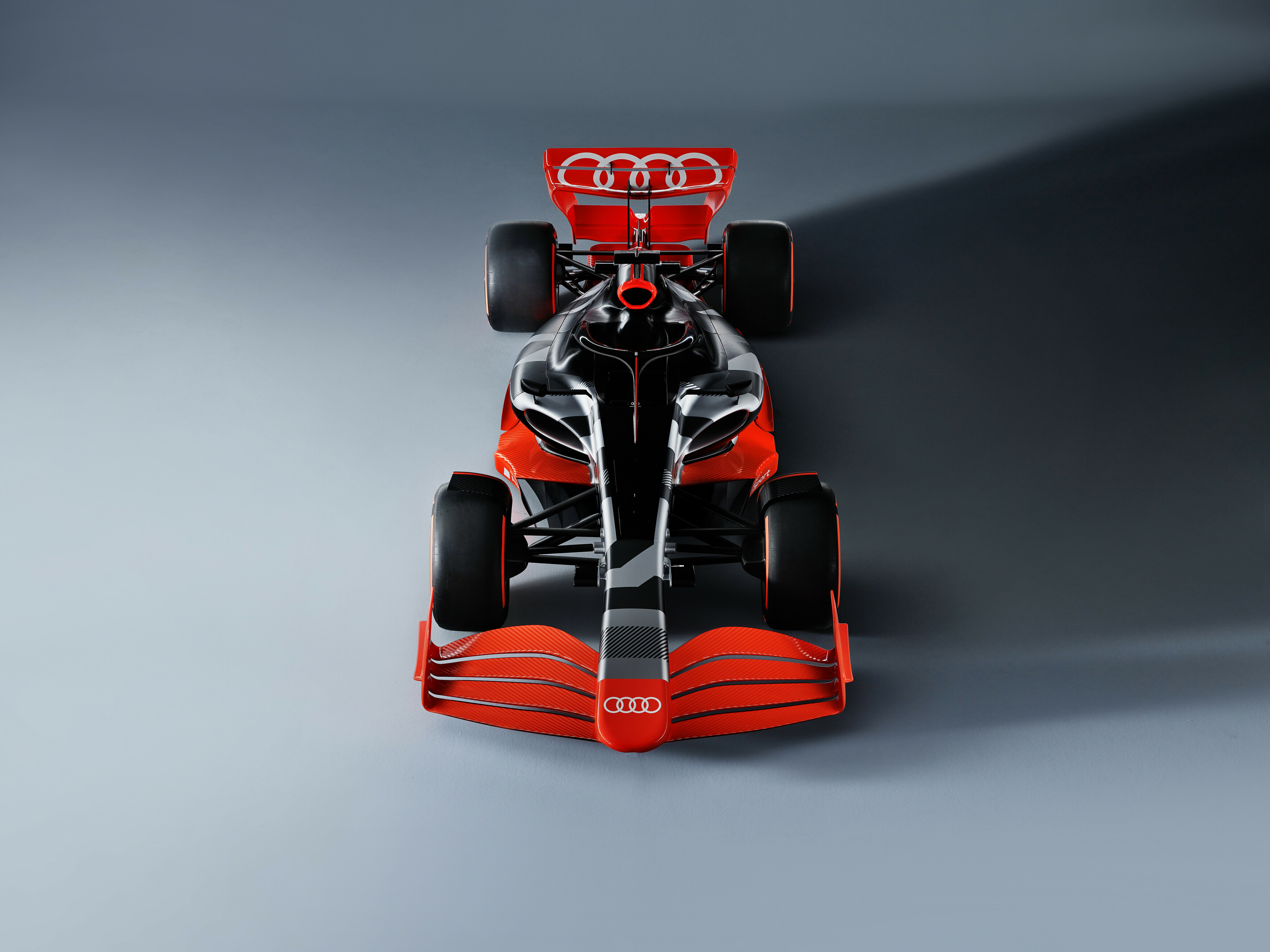 Imagem ilustrativa do carro-conceito vermelho da Audi para a Fórmula 1 visto de cima. 