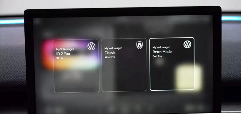 Volkswagen ID.2all Concept tem quadro de instrumentos e  multimídia com layouts que remetem ao Fusca e ao Golf: nesta imagem, tela de escolha entre os três modos de instrumentação do veículo.