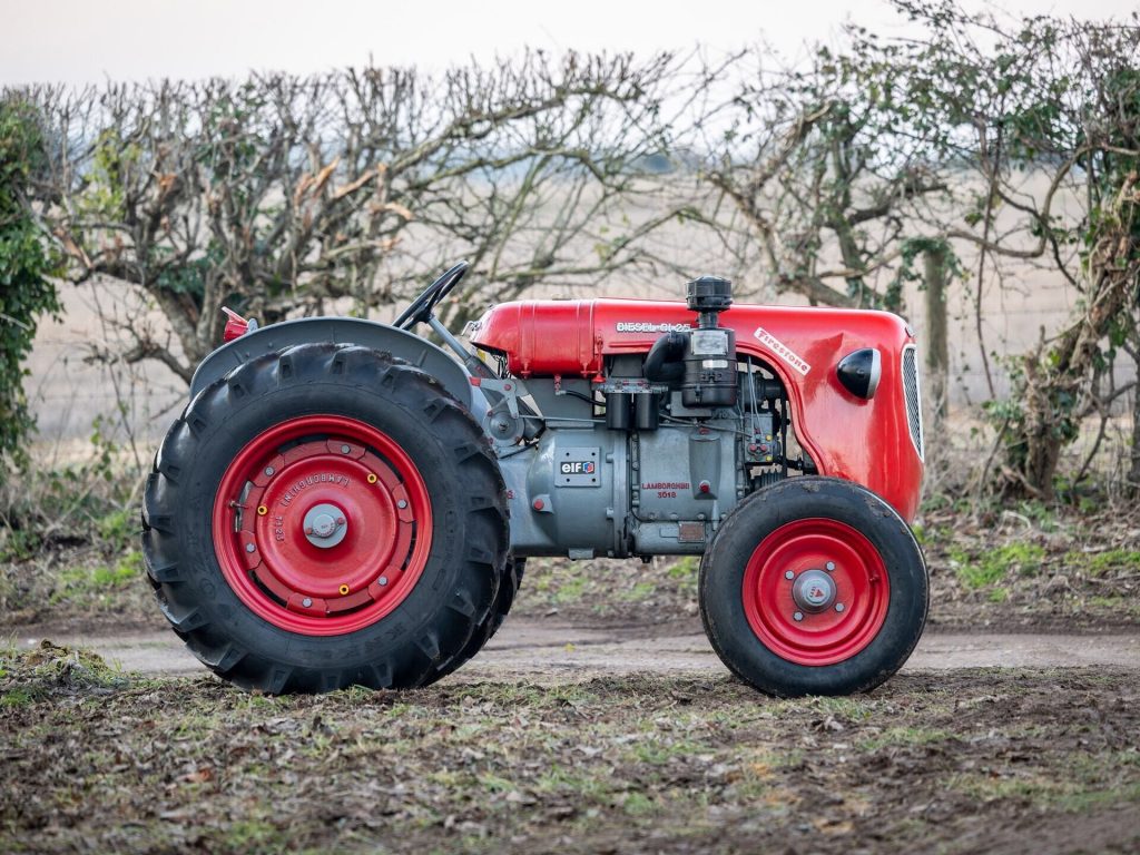 Red Lamborghini DL25 tractor from the side.